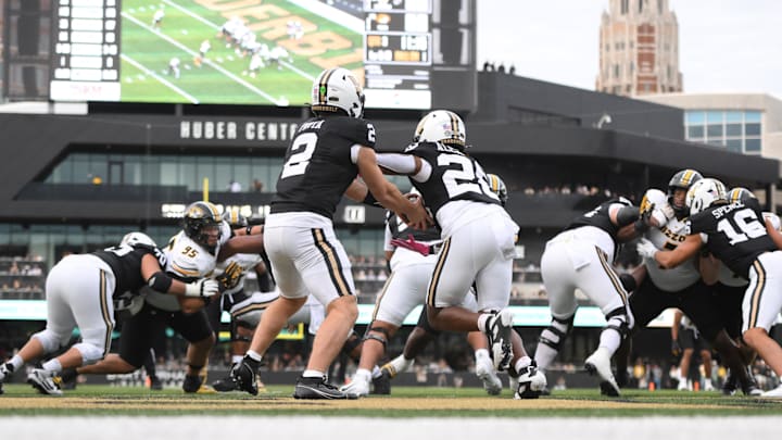 Oct 25, 2025; Nashville, Tennessee, USA; Vanderbilt Commodores quarterback Diego Pavia (2) hands off to running back Sedrick Alexander (28) in the end zone during the third quarter against the Missouri Tigers at FirstBank Stadium. Mandatory Credit: Steve Roberts-Imagn Images Oct 25, 2025; Nashville, Tennessee, USA; Vanderbilt Commodores quarterback Diego Pavia (2) hands off to running back Sedrick Alexander (28) in the end zone during the third quarter against the Missouri Tigers at FirstBank Stadium. Mandatory Credit: Steve Roberts-Imagn Images