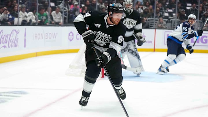Nov 27, 2024; Los Angeles, California, USA; LA Kings defenseman Vladislav Gavrikov (84) skates with the puck against the Winnipeg Jets in the first period at Crypto.com Arena. Mandatory Credit: Kirby Lee-Imagn Images
