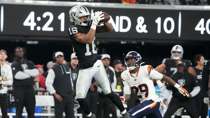 Nov 24, 2024; Paradise, Nevada, USA; Las Vegas Raiders wide receiver Jakobi Meyers (16) catches the ball against Denver Broncos cornerback Ja'Quan McMillian (29) in the fourth quarter at Allegiant Stadium. Mandatory Credit: Kirby Lee-Imagn Images