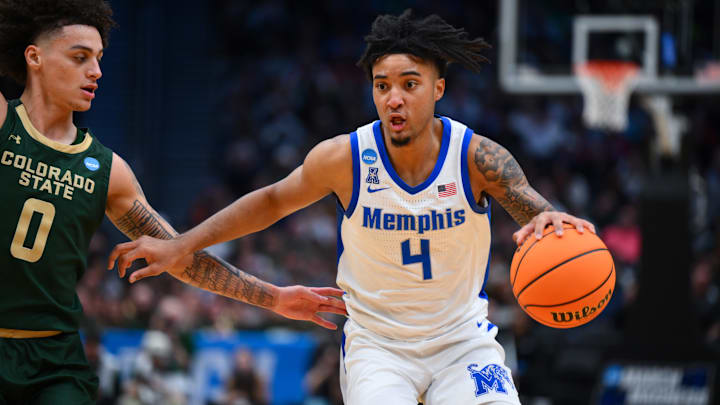 Mar 21, 2025; Seattle, WA, USA; Memphis Tigers guard PJ Haggerty (4) drives the ball during the second half against Colorado State Rams at Climate Pledge Arena. Mandatory Credit: Steven Bisig-Imagn Images