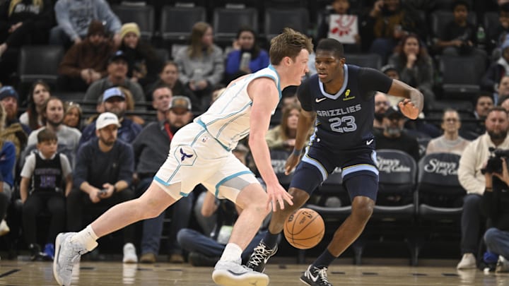 Jan 28, 2026; Memphis, Tennessee, USA; Charlotte Hornets guard Kon Knuepple (7) drives past defender Memphis Grizzlies forward Jalen Wells (0) in the first quarter at FedExForum. Mandatory Credit: Matthew Smith-Imagn Images Jan 28, 2026; Memphis, Tennessee, USA; Charlotte Hornets guard Kon Knuepple (7) drives past defender Memphis Grizzlies forward Jalen Wells (0) in the first quarter at FedExForum. Mandatory Credit: Matthew Smith-Imagn Images