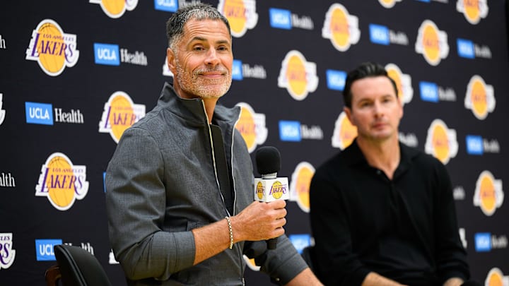 Sep 25, 2025; El Segundo, CA, USA; Los Angeles Lakers general manager Rob Pelinka, left, speaks during a press conference to preview the 2025-26 season at UCLA Health Training Center. Mandatory Credit: William Liang-Imagn Images