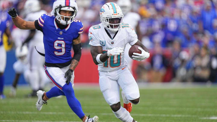 Miami Dolphins wide receiver Tyreek Hill (10) runs with the ball against Buffalo Bills safety Taylor Rapp (9) during the second half at Highmark Stadium last Sunday.
