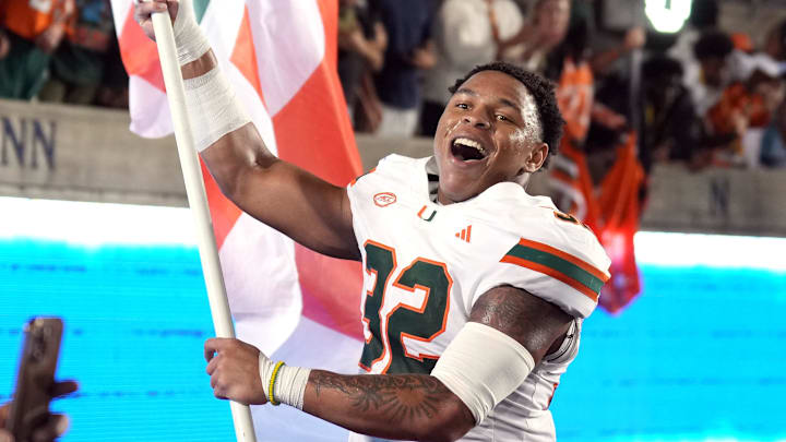 Oct 5, 2024; Berkeley, California, USA; Miami Hurricanes linebacker Raul Aguirre Jr. (32) carries a flag after defeating the California Golden Bears at California Memorial Stadium.