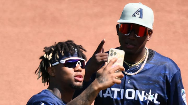 National League right fielder  Ronald Acuna Jr. of the Atlanta Braves (13) and  shortstop Geraldo Perdomo  of the Arizona Diamondbacks (2) take a picture during practice before the game at T-Mobile Park on Jul 11, 2023.