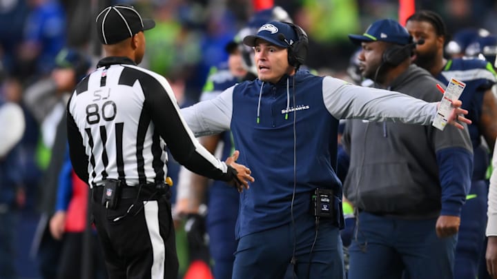 Nov 3, 2024; Seattle, Washington, USA; Seattle Seahawks head coach Mike Macdonald interacts with a referee during the second half against the Los Angeles Rams at Lumen Field. 
