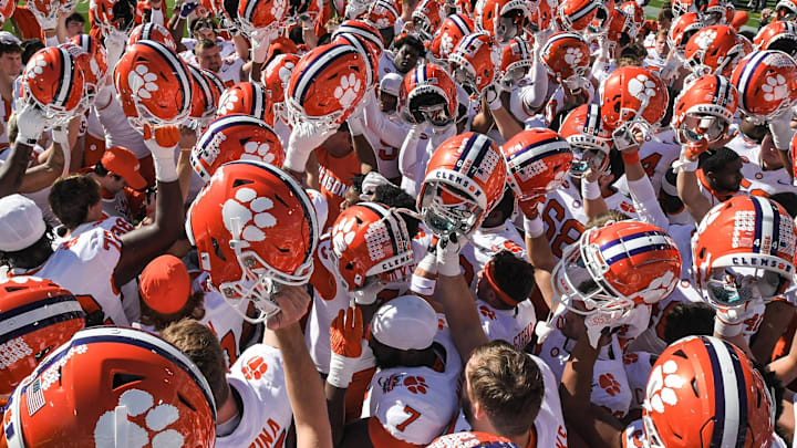 Clemson head coach Dabo Swinney talks with players before the TaxSlayer Gator Bowl