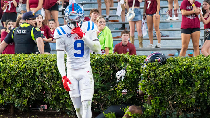 Oct 5, 2024; Columbia, South Carolina, USA; Mississippi Rebels wide receiver Tre Harris (9) celebrates knocking a pass away from South Carolina Gamecocks wide receiver Dalevon Campbell (15), in the hedge, in the second half at Williams-Brice Stadium. Mandatory Credit: Jeff Blake-Imagn Images Oct 5, 2024; Columbia, South Carolina, USA; Mississippi Rebels wide receiver Tre Harris (9) celebrates knocking a pass away from South Carolina Gamecocks wide receiver Dalevon Campbell (15), in the hedge, in the second half at Williams-Brice Stadium. Mandatory Credit: Jeff Blake-Imagn Images