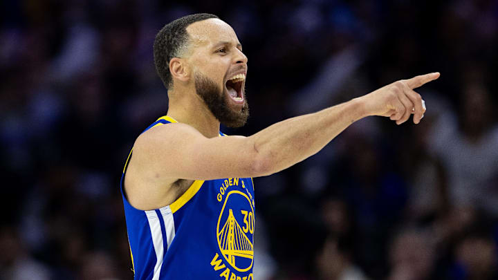 Golden State Warriors guard Stephen Curry (30) reacts after his dunk against the Philadelphia 76ers during the fourth quarter at Wells Fargo Center. 