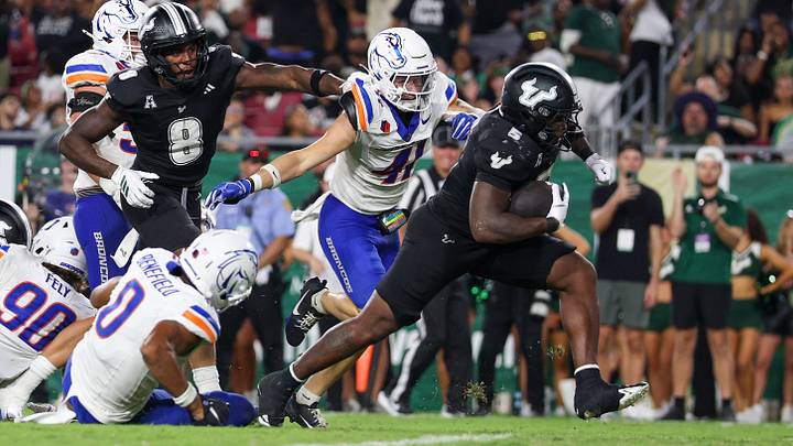 South Florida Bulls running back Cartevious Norton breaks away from Boise State linebacker Boen Phelps. South Florida Bulls running back Cartevious Norton breaks away from Boise State linebacker Boen Phelps.