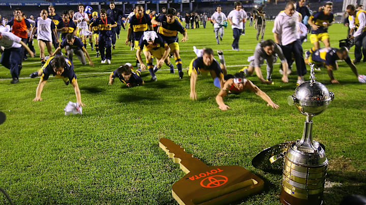 Boca Juniors players jubilate after defe...