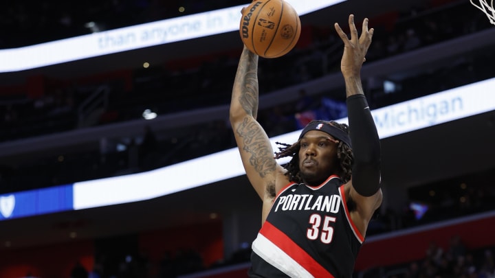 Nov 1, 2023; Detroit, Michigan, USA;  Portland Trail Blazers center Robert Williams III (35) grabs the rebound over Detroit Pistons guard Killian Hayes (7) in the first half at Little Caesars Arena. Mandatory Credit: Rick Osentoski-USA TODAY Sports