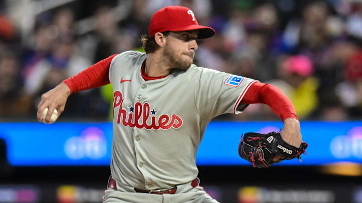 Apr 21, 2025; New York City, New York, USA; Philadelphia Phillies pitcher Aaron Nola (27) pitches against the New York Mets during the first inning at Citi Field. Mandatory Credit: John Jones-Imagn Images