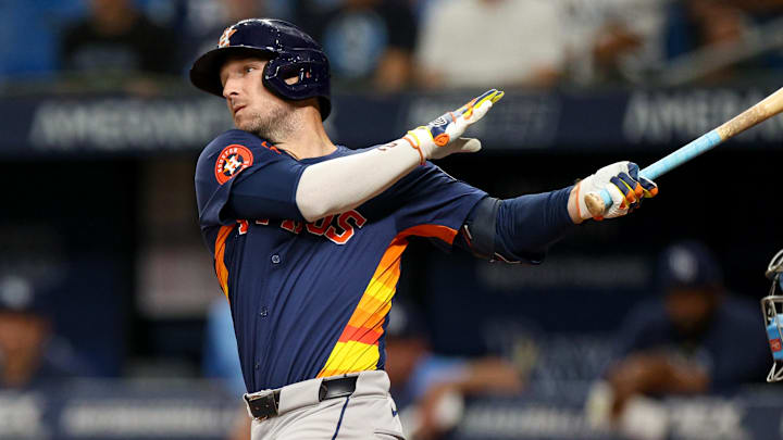Aug 12, 2024; St. Petersburg, Florida, USA; Houston Astros third baseman Alex Bregman (2) hits a home run against the Tampa Bay Rays in the first inning  at Tropicana Field. Mandatory Credit: Nathan Ray Seebeck-Imagn Images