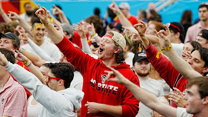 North Carolina State fans cheer before their Final Four semifinal game against Purdue at State Farm Stadium.