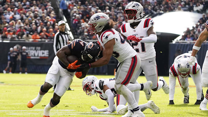 D'Andre Swift tries to scratch out a yard after being stacked up behind the line against New England.