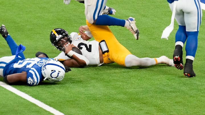 Pittsburgh Steelers quarterback Justin Fields (2) slides after rushing the ball Sunday, Sept. 29, 2024, during a game against the Pittsburgh Steelers at Lucas Oil Stadium in Indianapolis.