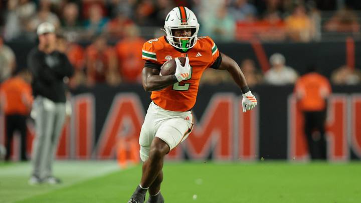 Oct 17, 2025; Miami Gardens, Florida, USA; Miami Hurricanes running back Jordan Lyle (2) carries the football against the Louisville Cardinals during the fourth quarter at Hard Rock Stadium. Mandatory Credit: Sam Navarro-Imagn Images Oct 17, 2025; Miami Gardens, Florida, USA; Miami Hurricanes running back Jordan Lyle (2) carries the football against the Louisville Cardinals during the fourth quarter at Hard Rock Stadium. Mandatory Credit: Sam Navarro-Imagn Images