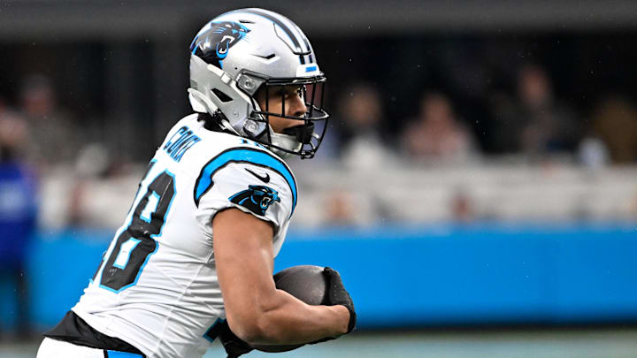 Dec 15, 2024; Charlotte, North Carolina, USA; Carolina Panthers wide receiver Jalen Coker (18) with the ball in the fourth quarter at Bank of America Stadium. Mandatory Credit: Bob Donnan-Imagn Images