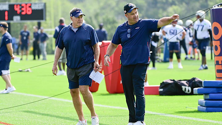Jul 26, 2023; Foxborough, MA, USA; New England Patriots offensive coordinator/quarterbacks coach Bill O'Brien  (right) points something out to head coach Bill Belichick during training camp  at Gillette Stadium. Mandatory Credit: Eric Canha-Imagn Images