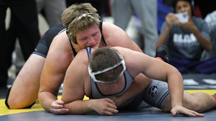 Mike Millin of Massillon Perry, top, wrestles TJ Kellas of Blair Academy during their 285 pound consolation match during the 2024 Ironman Wrestling Tournament at Walsh Jesuit High School on Saturday, Dec. 7, 2024, in Cuyahoga Falls, Ohio.