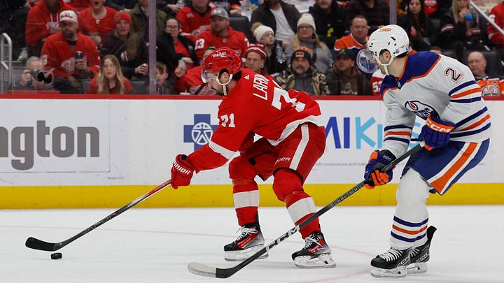 Jan 11, 2024; Detroit, Michigan, USA; Detroit Red Wings center Dylan Larkin (71) skates with the puck defended by Edmonton Oilers defenseman Evan Bouchard (2) in the second period at Little Caesars Arena. Mandatory Credit: Rick Osentoski-USA TODAY Sports Jan 11, 2024; Detroit, Michigan, USA; Detroit Red Wings center Dylan Larkin (71) skates with the puck defended by Edmonton Oilers defenseman Evan Bouchard (2) in the second period at Little Caesars Arena. Mandatory Credit: Rick Osentoski-USA TODAY Sports