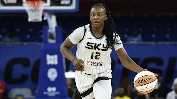 Aug 5, 2025; Chicago, Illinois, USA; Chicago Sky forward Michaela Onyenwere (12) brings the ball up court against the Washington Mystics during the first half at Wintrust Arena. Mandatory Credit: Kamil Krzaczynski-Imagn Images