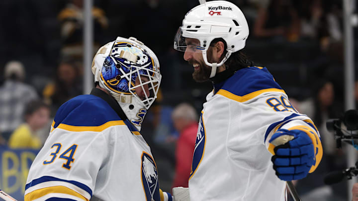 May 1, 2026; Boston, Massachusetts, USA; Buffalo Sabres right wing Alex Tuch (89) celebrates with goaltender Alex Lyon (34) after their 4-1 win over the Boston Bruins in game six of the first round of the 2026 Stanley Cup Playoffs at TD Garden. Mandatory Credit: Winslow Townson-Imagn Images