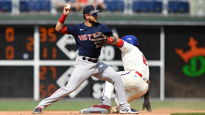May 23, 2021; Philadelphia, Pennsylvania, USA; Boston Red Sox infielder Michael Chavis (23) attempts to turn a double play over Philadelphia Phillies infielder Jean Segura (2) in the seventh inning at Citizens Bank Park. Mandatory Credit: Kyle Ross-Imagn Images