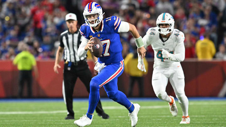 Sep 18, 2025; Orchard Park, New York, USA; Buffalo Bills quarterback Josh Allen (17) runs against the Miami Dolphins in the second half