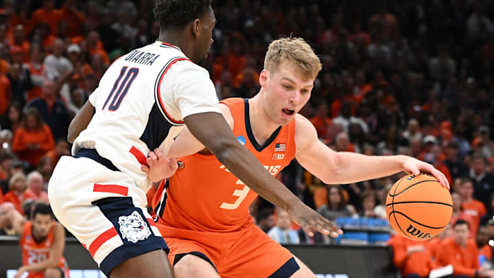 Mar 30, 2024; Boston, MA, USA; Illinois Fighting Illini forward Marcus Domask (3) dribbles the ball against Connecticut Huskies guard Tristen Newton (2) in the finals of the East Regional of the 2024 NCAA Tournament at TD Garden. Mandatory Credit: Brian Fluharty-Imagn Images