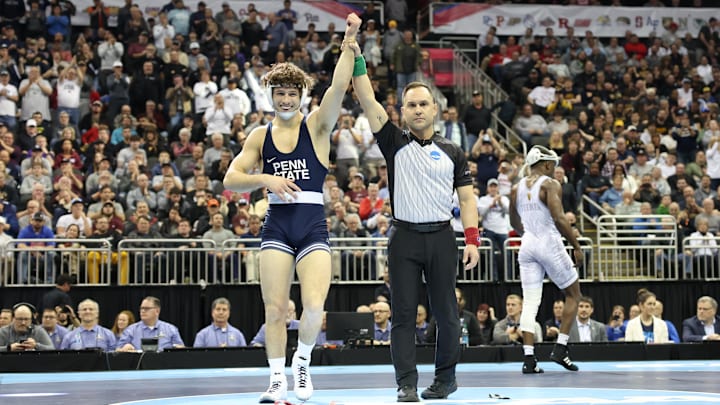 Penn State's Levi Haines gets his hand raised after winning the 157-pound title at the 2024 NCAA Wrestling Championships. 