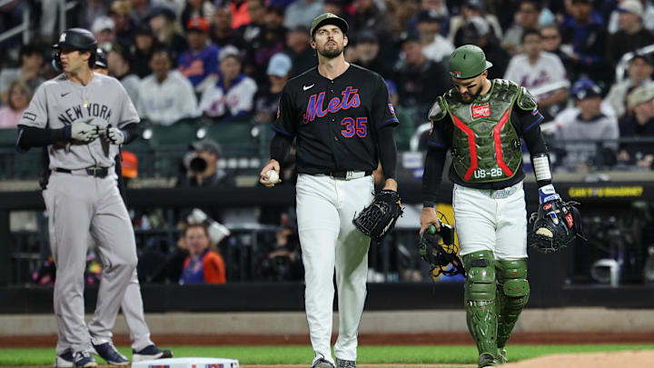 May 15, 2026; New York City, New York, USA; New York Mets catcher Luis Torrens (13) looks down at the leg of pitcher Clay Holmes (35) during the fifth inning against the New York Yankees at Citi Field. Mandatory Credit: Vincent Carchietta-Imagn Images