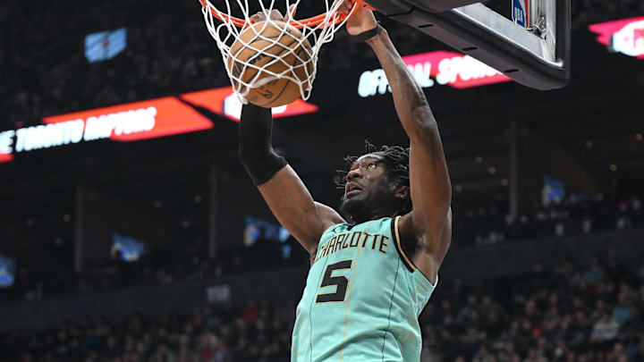 Mar 28, 2025; Toronto, Ontario, CAN;  Charlotte Hornets center Mark Williams (5) dunks for a basket against the Toronto Raptors in the second half at Scotiabank Arena. Mandatory Credit: Dan Hamilton-Imagn Images
