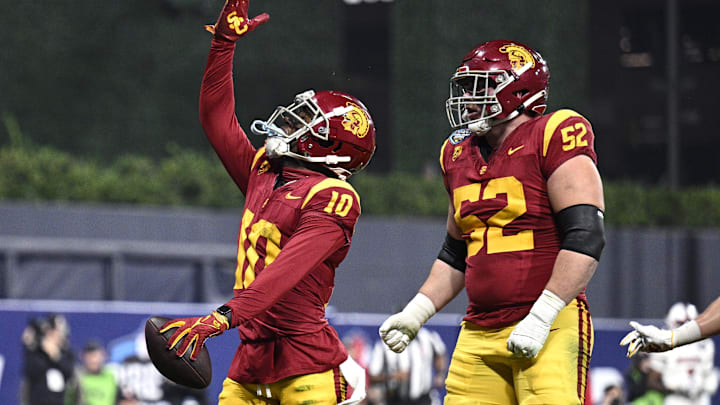 Dec 27, 2023; San Diego, CA, USA; USC Trojans wide receiver Kyron Hudson (10) celebrates after scoring a touchdown against the Louisville Cardinals during the first half at Petco Park. Mandatory Credit: Orlando Ramirez-USA TODAY Sports