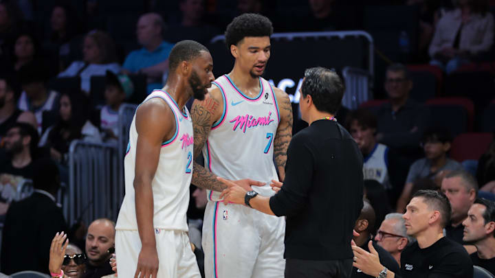 Mar 8, 2025; Miami, Florida, USA; Miami Heat head coach Erik Spoelstra talks to center Kel'el Ware (7) and forward Andrew Wiggins (22) against the Chicago Bulls during the third quarter at Kaseya Center. Mandatory Credit: Sam Navarro-Imagn Images