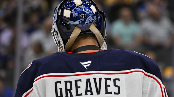 Oct 1, 2024; St. Louis, Missouri, USA;  A detailed view of Columbus Blue Jackets goaltender Jet Greaves (73) goalie mask honoring Johnny and Matthew Gaudreau during the second period against the St. Louis Blues at Enterprise Center. Mandatory Credit: Jeff Curry-Imagn Images
