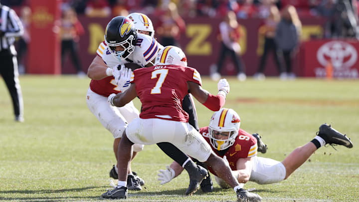 Nov 22, 2025; Ames, Iowa, USA; Iowa State Cyclones defensive back Tre Bell (7) tackles Kansas Jayhawks wide receiver Levi Wentz (10) during the second half at Jack Trice Stadium. Mandatory Credit: Reese Strickland-Imagn Images