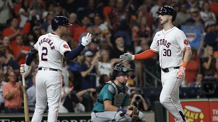 Sep 24, 2024; Houston, Texas, USA; Houston Astros third baseman Alex Bregman (2) celebrates right fielder Kyle Tucker (30)  home run against the Seattle Mariners  in the fourth inning at Minute Maid Park.