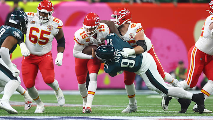 Feb 9, 2025; New Orleans, LA, USA; Kansas City Chiefs quarterback Patrick Mahomes (15) is tackled by Philadelphia Eagles defensive tackle Jordan Davis (90) in Super Bowl LIX between the Philadelphia Eagles and the Kansas City Chiefs at Ceasars Superdome. Mandatory Credit: Mark J. Rebilas-Imagn Images