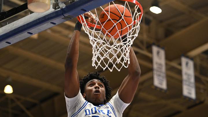 Feb 16, 2026; Durham, North Carolina, USA; Duke Blue Devils center Patrick Ngongba II (21) dunks the ball against the Syracuse Orange during the second half at Cameron Indoor Stadium.