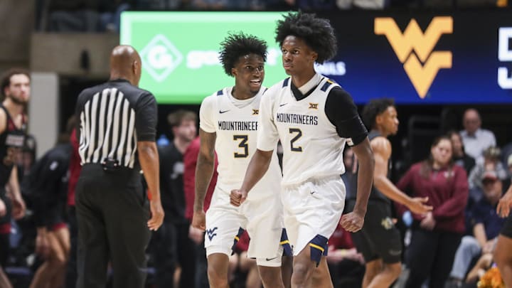 Nov 17, 2025; Morgantown, West Virginia, USA; West Virginia Mountaineers guard Honor Huff (3) celebrates with West Virginia Mountaineers guard Amir Jenkins (2) during the second half against the Lafayette Leopards at WVU Coliseum. Mandatory Credit: Ben Queen-Imagn Images