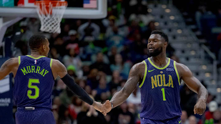 Jan 7, 2025; New Orleans, Louisiana, USA; New Orleans Pelicans guard Dejounte Murray (5) and New Orleans Pelicans forward Zion Williamson (1) celebrate a three-point basket made by Murray with an assist from Williamson during the first half against the Minnesota Timberwolves at Smoothie King Center. Mandatory Credit: Matthew Hinton-Imagn Images