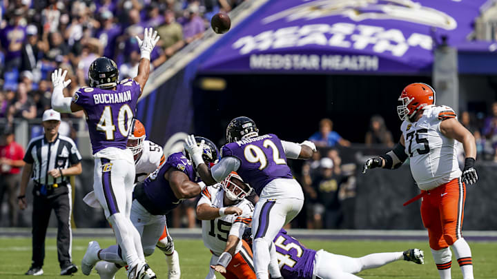 Sep 14, 2025; Baltimore, Maryland, USA; Cleveland Browns quarterback Joe Flacco (15) is tackled during the second quarter at M&T Bank Stadium. Mandatory Credit: Mitch Stringer-Imagn Images