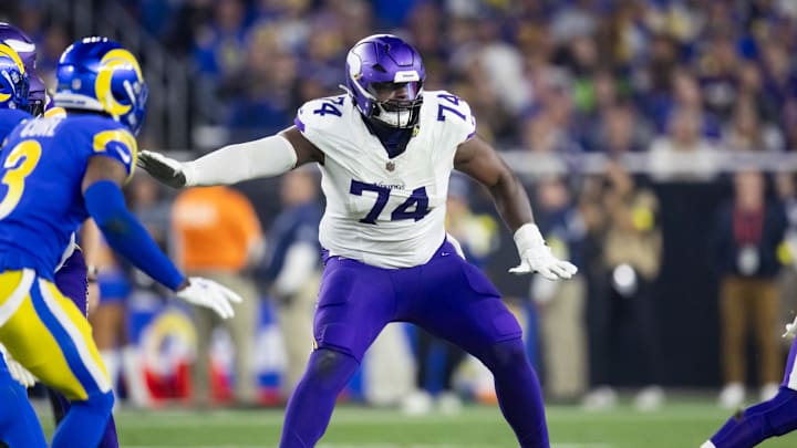 Jan 13, 2025; Glendale, AZ, USA; Minnesota Vikings tackle Cam Robinson (74) against the Los Angeles Rams during an NFC wild card game at State Farm Stadium. Mandatory Credit: Mark J. Rebilas-Imagn Images
