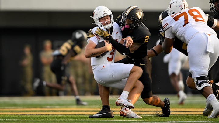 Oct 26, 2024; Nashville, Tennessee, USA;  Vanderbilt Commodores linebacker Randon Fontenette (2) sacks Texas Longhorns quarterback Quinn Ewers (3) during the first half at FirstBank Stadium.
