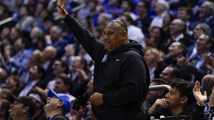Feb 24, 2026; Provo, Utah, USA; BYU Cougars football head coach Kalani Sitake salutes the crowd during second half of a game between the BYU Cougars and the UCF Knights at Marriott Center. Mandatory Credit: Aaron Baker-Imagn Images