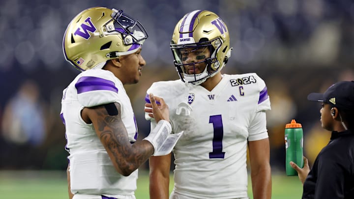 Jan 8, 2024; Houston, TX, USA; Washington Huskies quarterback Michael Penix Jr. (9) talks with wide receiver Rome Odunze (1) on the sideline.