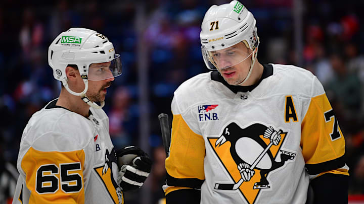 Jan 23, 2025; Anaheim, California, USA; Pittsburgh Penguins defenseman Erik Karlsson (65) speaks with center Evgeni Malkin (71) during the third period at Honda Center. Mandatory Credit: Gary A. Vasquez-Imagn Images