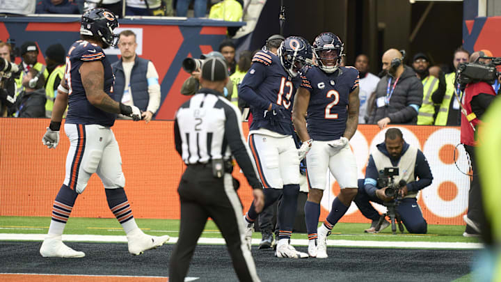 DJ Moore and Keenan Allen are ready to start the celebration after a touchdown by Allen in Sunday's win.